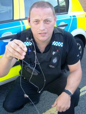 PC Simon Albutt with the illegal snares